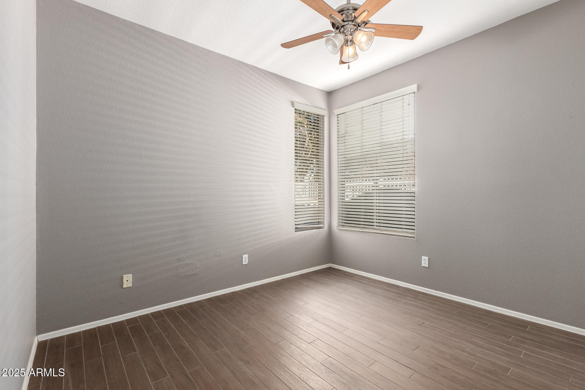 939 South Roca Street Gilbert, AZ 85296 - Photo 24 of 40 an empty room with wooden floor and windows