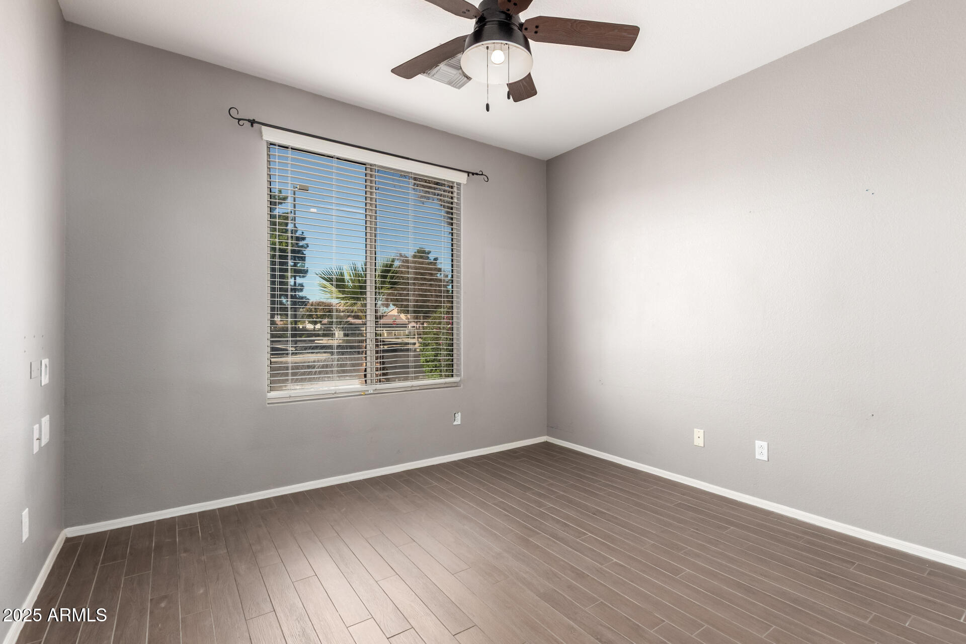 939 South Roca Street Gilbert, AZ 85296 - Photo 27 of 40 wooden floor in an empty room with a window