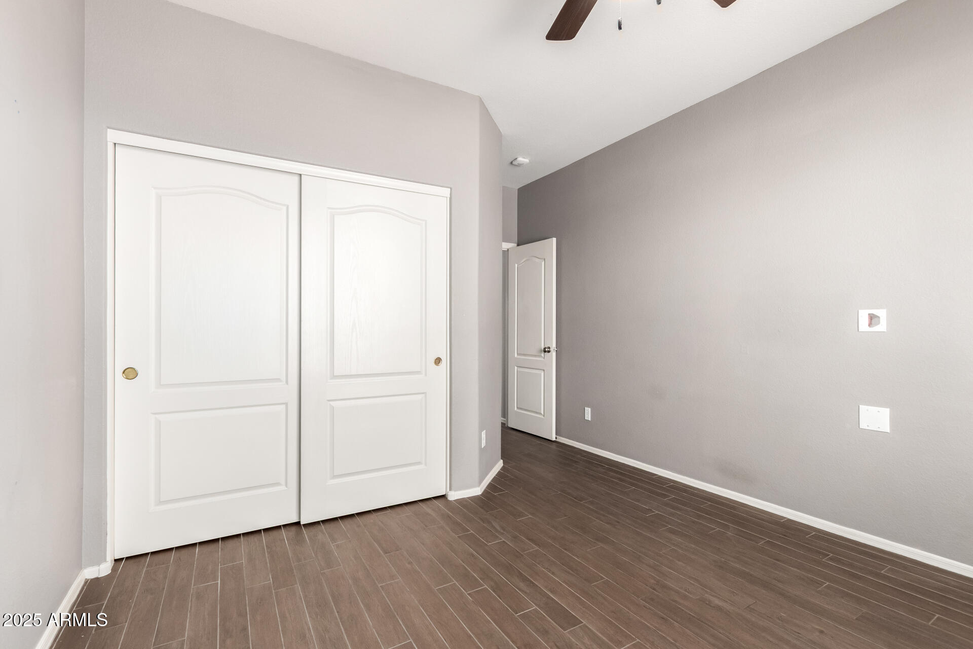 939 South Roca Street Gilbert, AZ 85296 - Photo 28 of 40 a view of an empty room with wooden floor