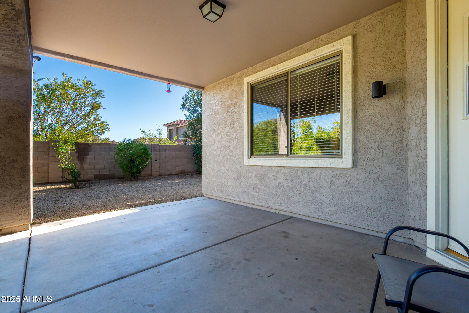 939 South Roca Street Gilbert, AZ 85296 - Photo 32 of 40 a view of a door and chair in the room