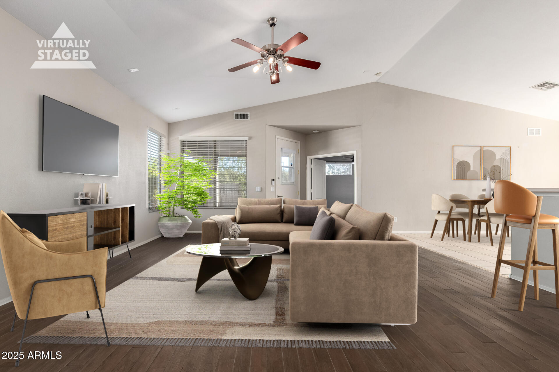 939 South Roca Street Gilbert, AZ 85296 - Photo 5 of 40 a living room with furniture and a flat screen tv