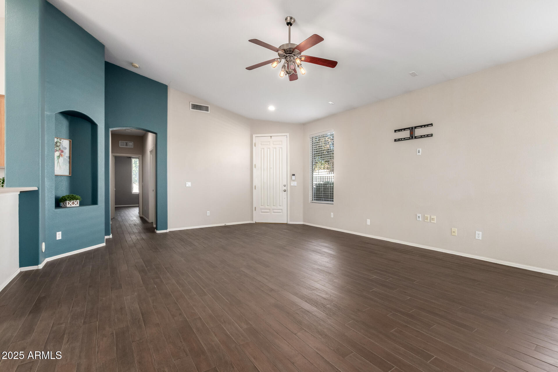 939 South Roca Street Gilbert, AZ 85296 - Photo 7 of 40 an empty room with fan and a ceiling fan