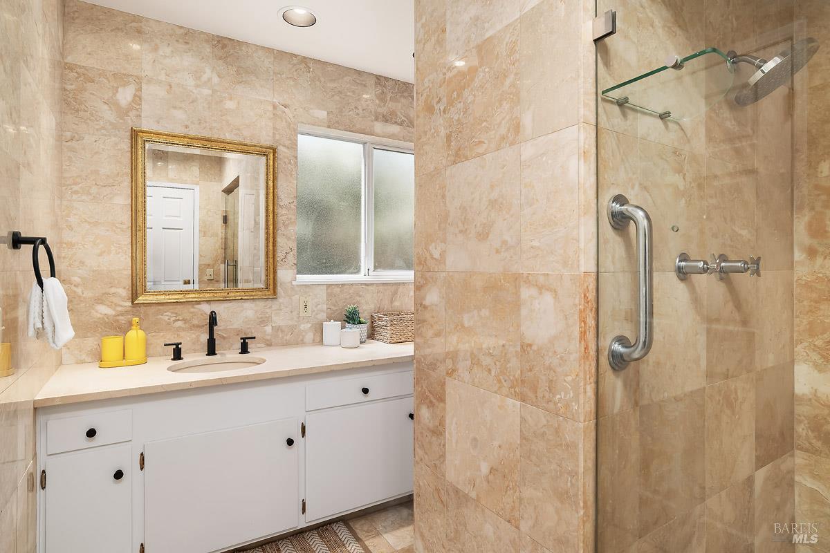 316 Riviera Drive San Rafael, CA 94901 - Photo 19 of 41 a bathroom with a double vanity sink mirror and shower