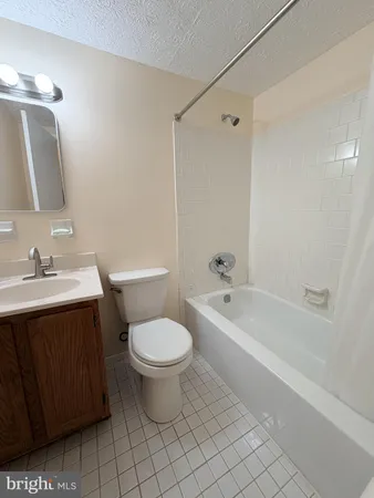 a bathroom with a sink toilet a bathtub and a shower