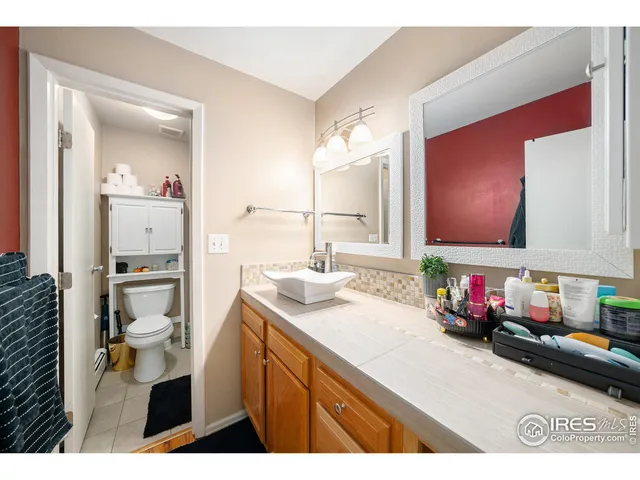 a bathroom with a sink mirror and vanity