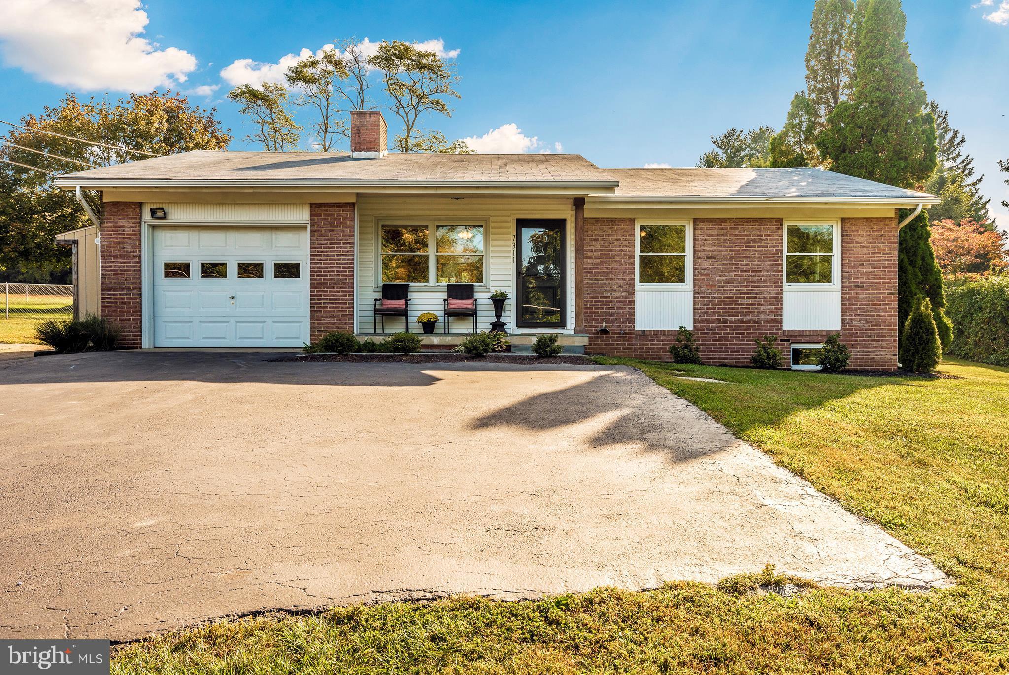 7311 Ridge Road Frederick, MD 21702 - Photo 1 of 30 a view of a house with patio and a yard