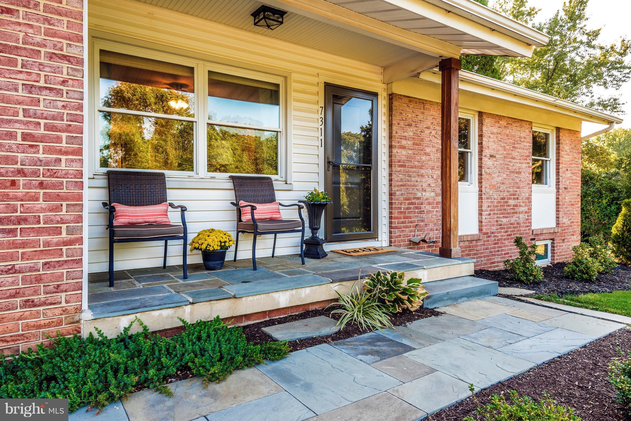 7311 Ridge Road Frederick, MD 21702 - Photo 2 of 30 a front view of a house with outdoor seating area