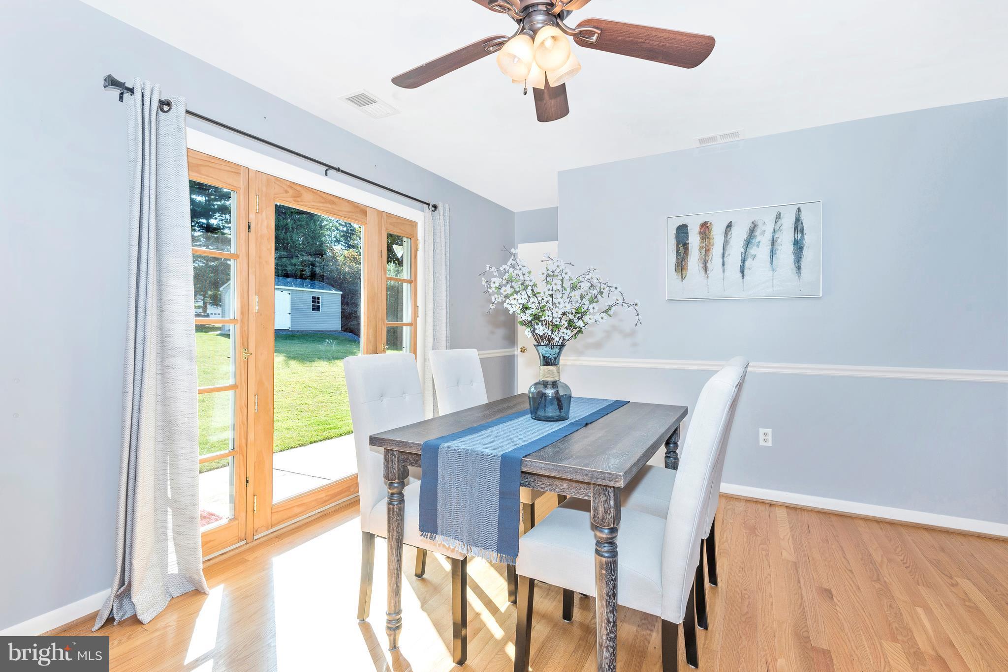 7311 Ridge Road Frederick, MD 21702 - Photo 14 of 30 a view of a dining room with furniture window and wooden floor