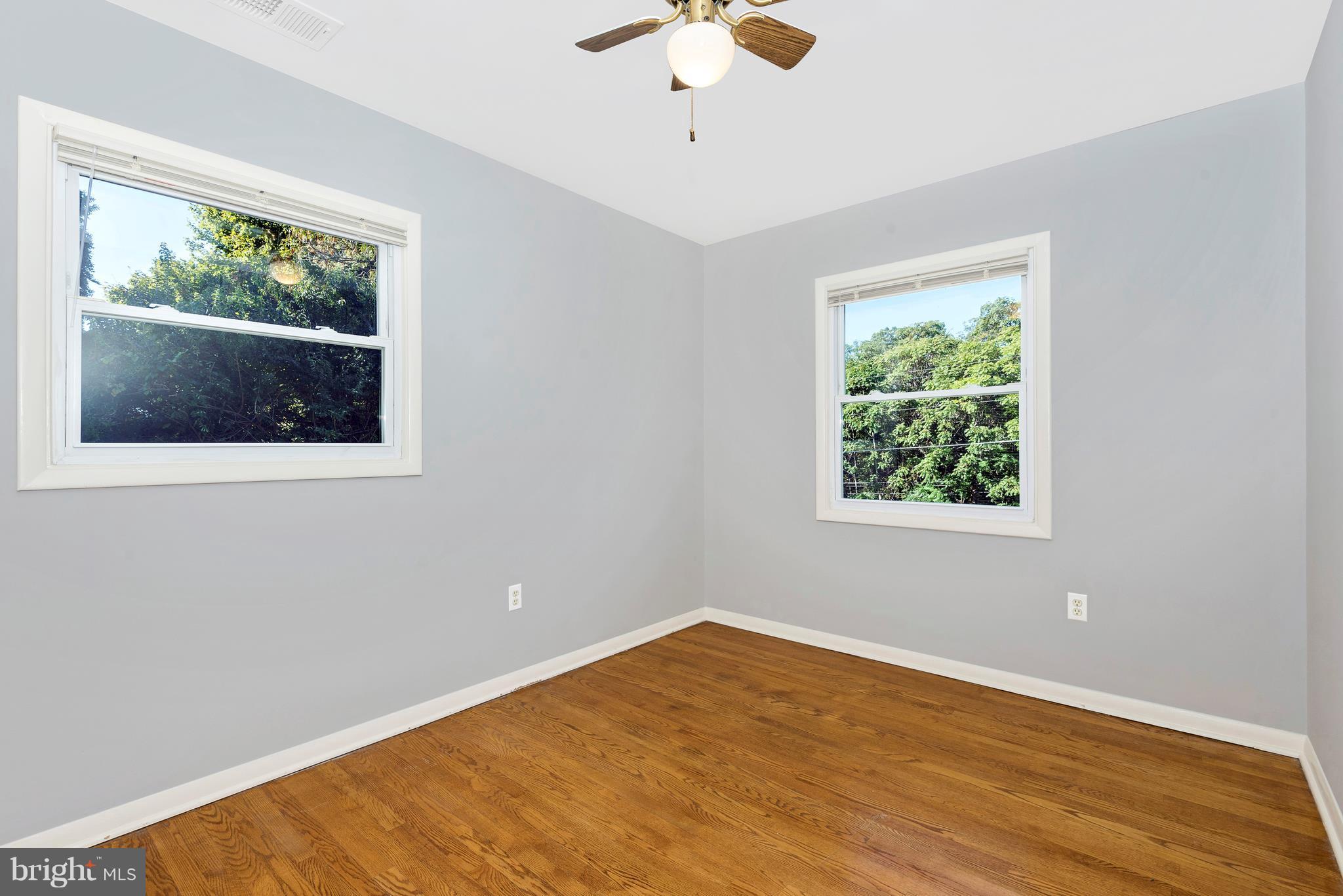 7311 Ridge Road Frederick, MD 21702 - Photo 19 of 30 a view of empty room with wooden floor and fan