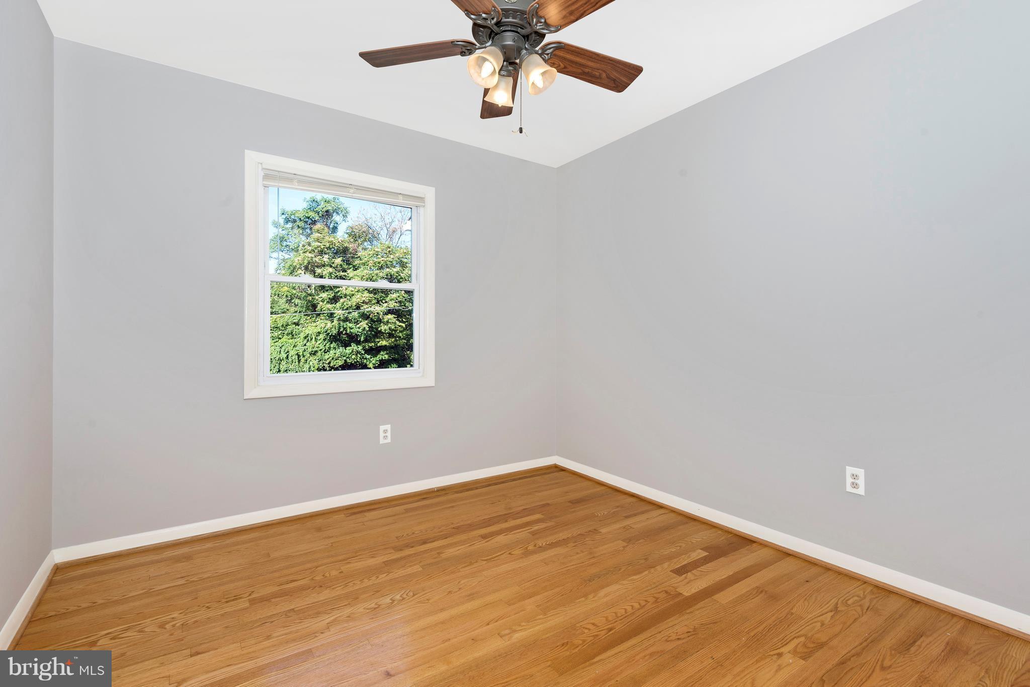 7311 Ridge Road Frederick, MD 21702 - Photo 20 of 30 an empty room with a window and a fan