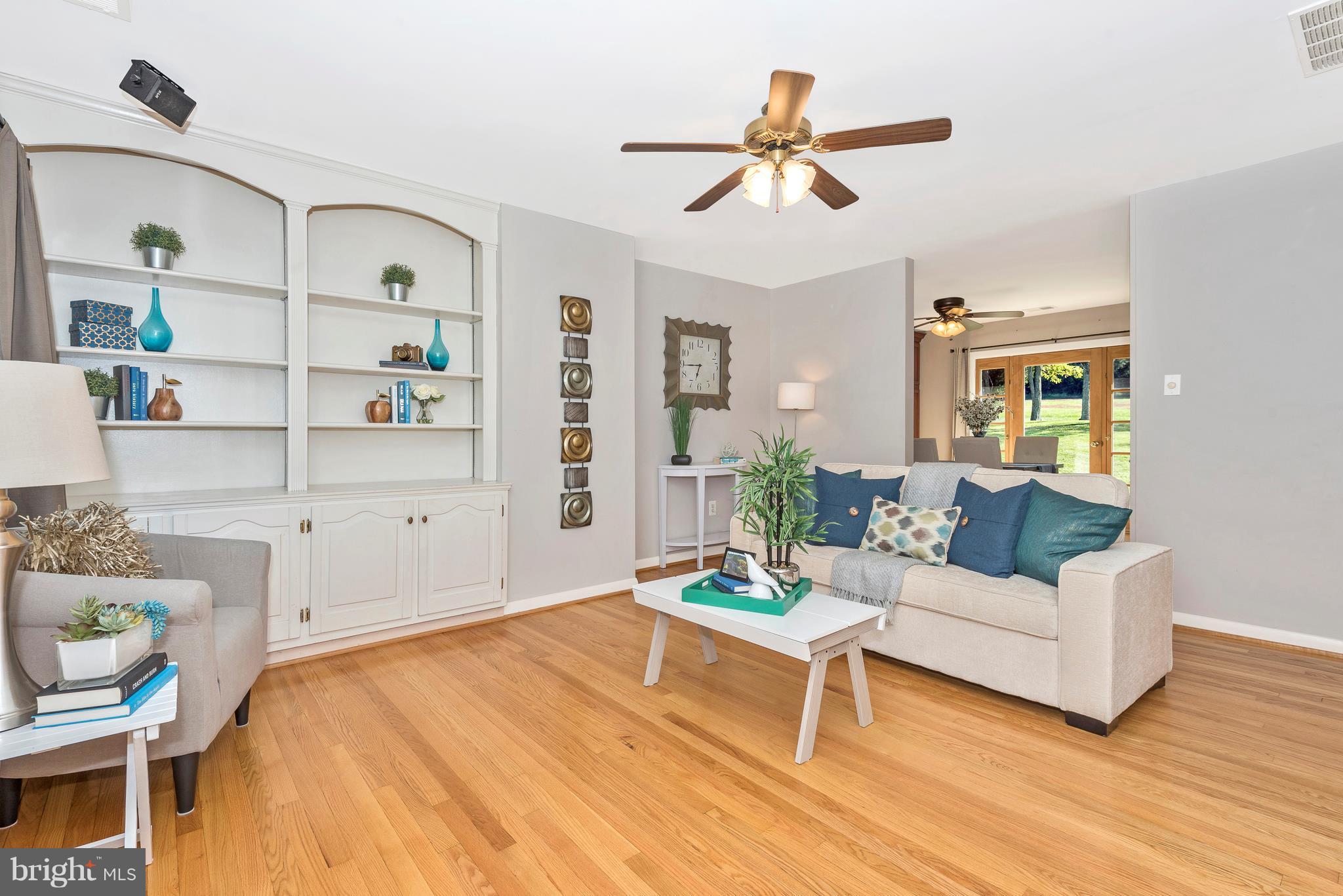 7311 Ridge Road Frederick, MD 21702 - Photo 3 of 30 a living room with furniture and a wooden floor
