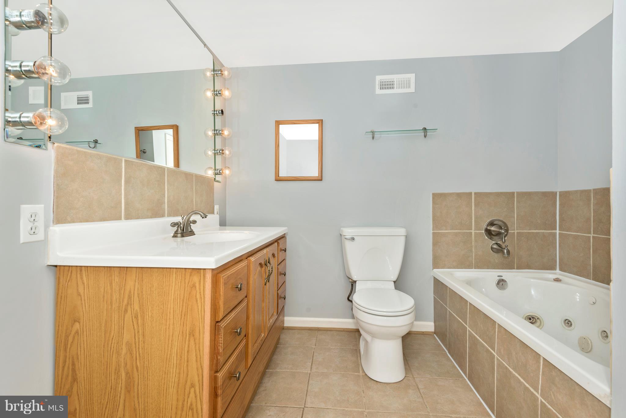 7311 Ridge Road Frederick, MD 21702 - Photo 25 of 30 a bathroom with a sink a toilet and shower