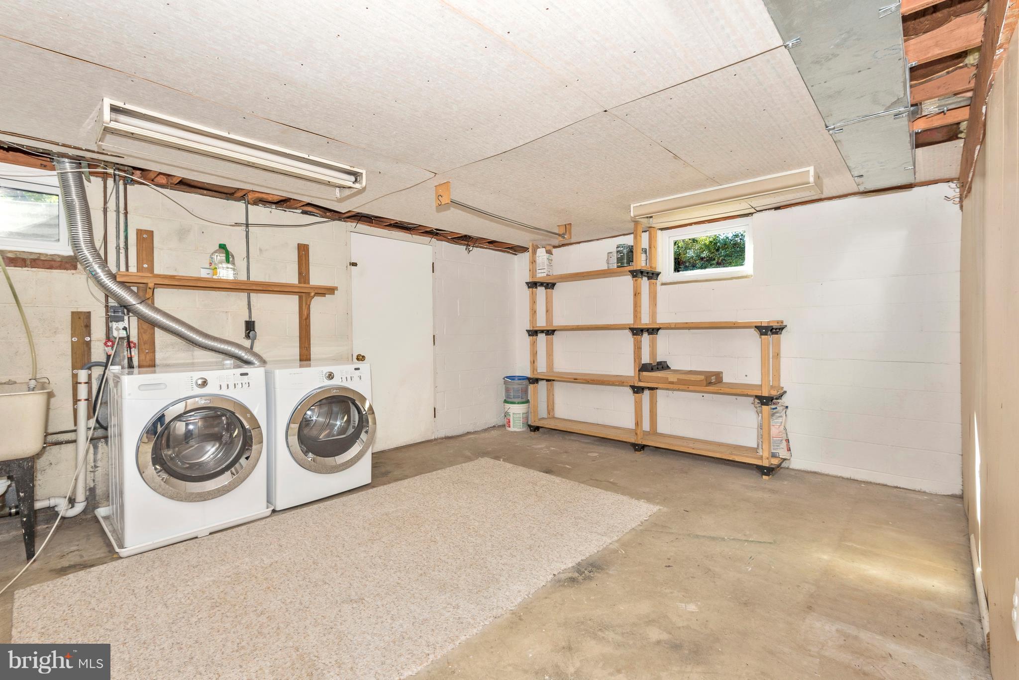 7311 Ridge Road Frederick, MD 21702 - Photo 26 of 30 a view of a storage & utility room with washer and dryer