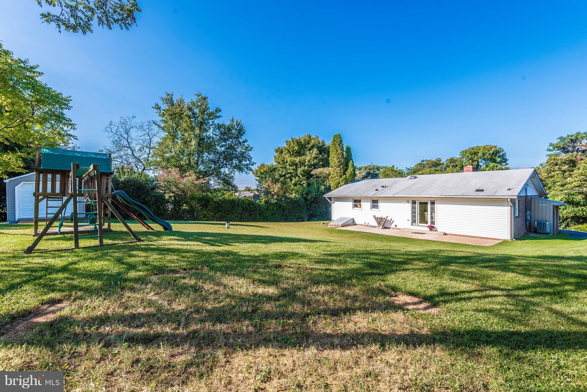7311 Ridge Road Frederick, MD 21702 - Photo 29 of 30 a backyard of a house with table and chairs