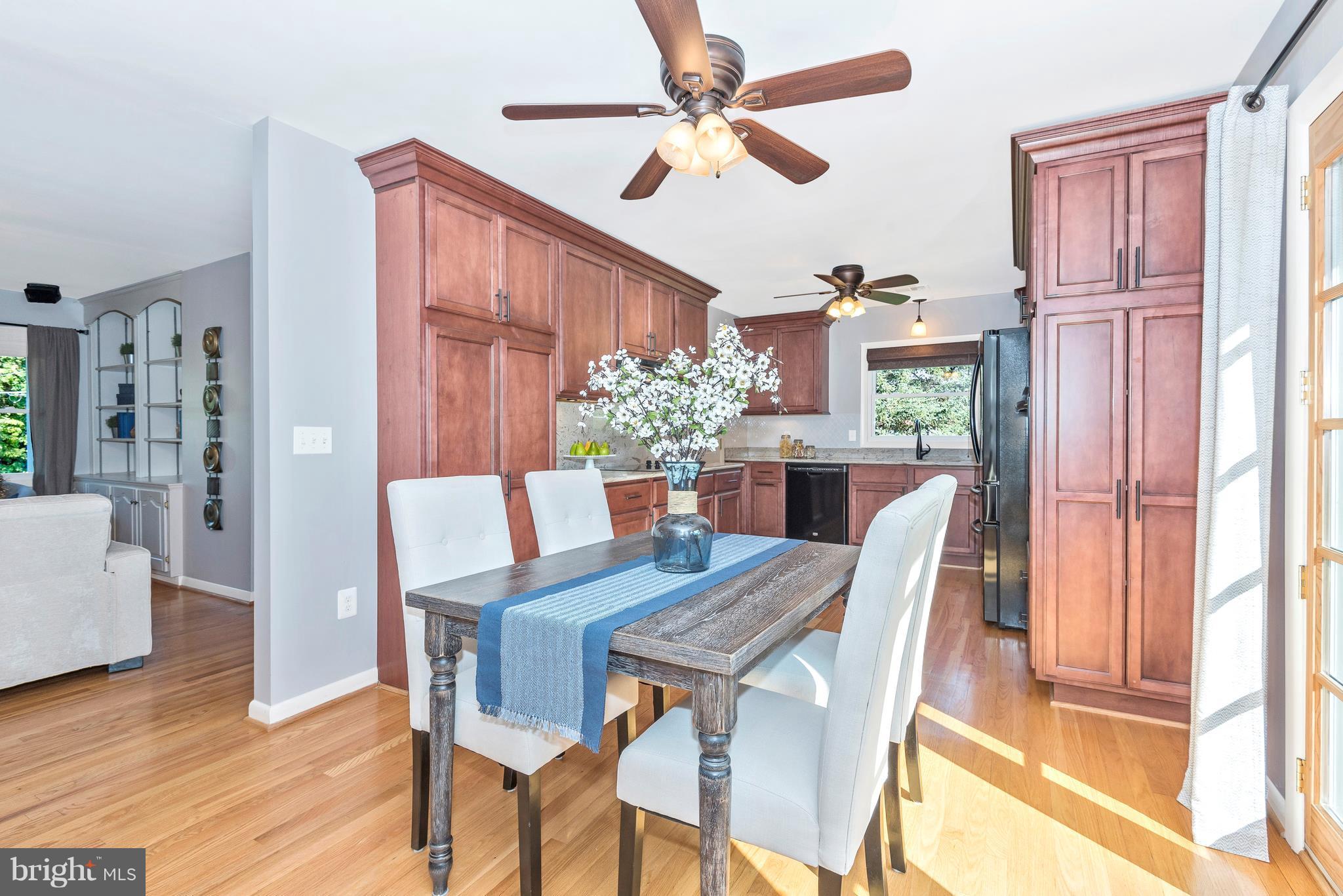 7311 Ridge Road Frederick, MD 21702 - Photo 7 of 30 a view of a dining room with furniture window and wooden floor