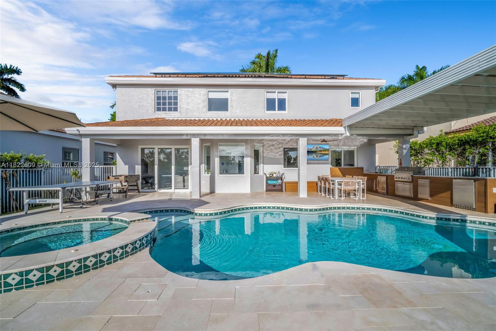 942 Lavender Circle Weston, FL 33327 - Photo 1 of 68 a view of a house with sitting area and swimming pool