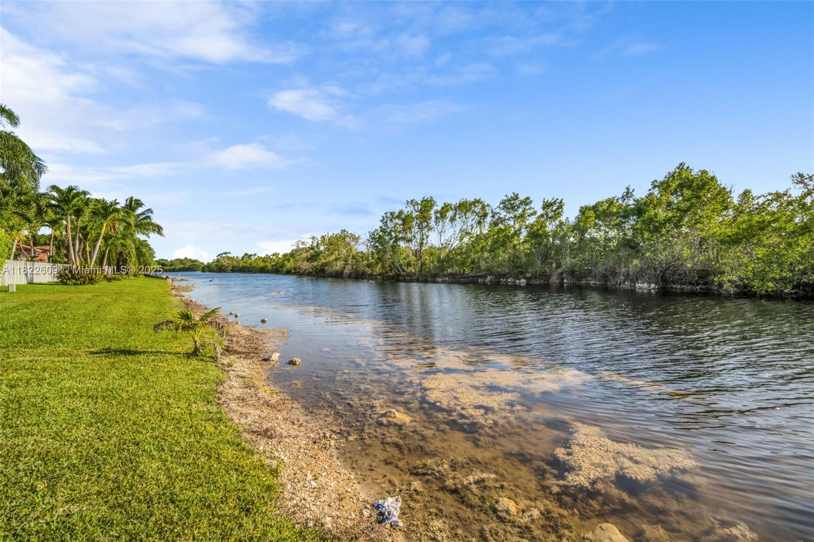 942 Lavender Circle Weston, FL 33327 - Photo 14 of 68 a view of a lake with houses in the back