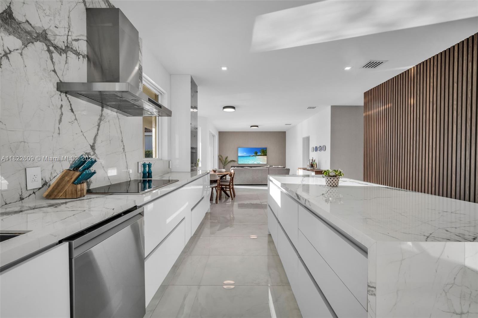 942 Lavender Circle Weston, FL 33327 - Photo 25 of 68 a large white kitchen with a large window