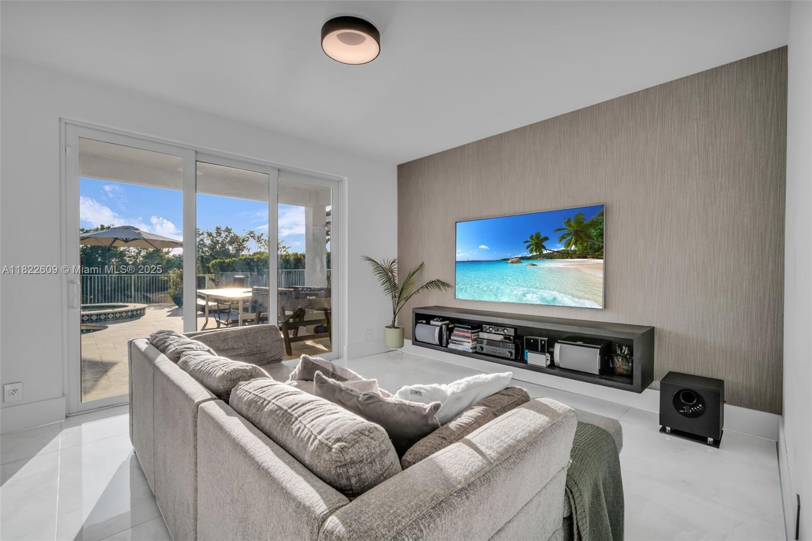 942 Lavender Circle Weston, FL 33327 - Photo 29 of 68 a living room with furniture and a flat screen tv