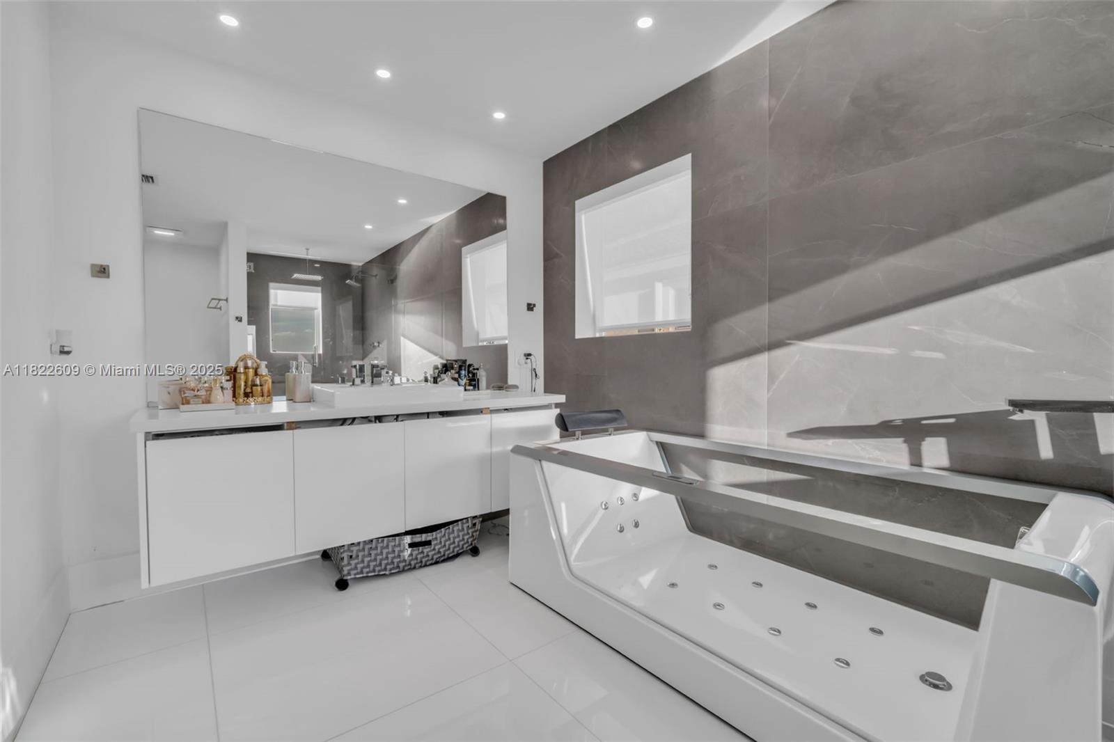 942 Lavender Circle Weston, FL 33327 - Photo 36 of 68 a kitchen with granite countertop white cabinets and white appliances