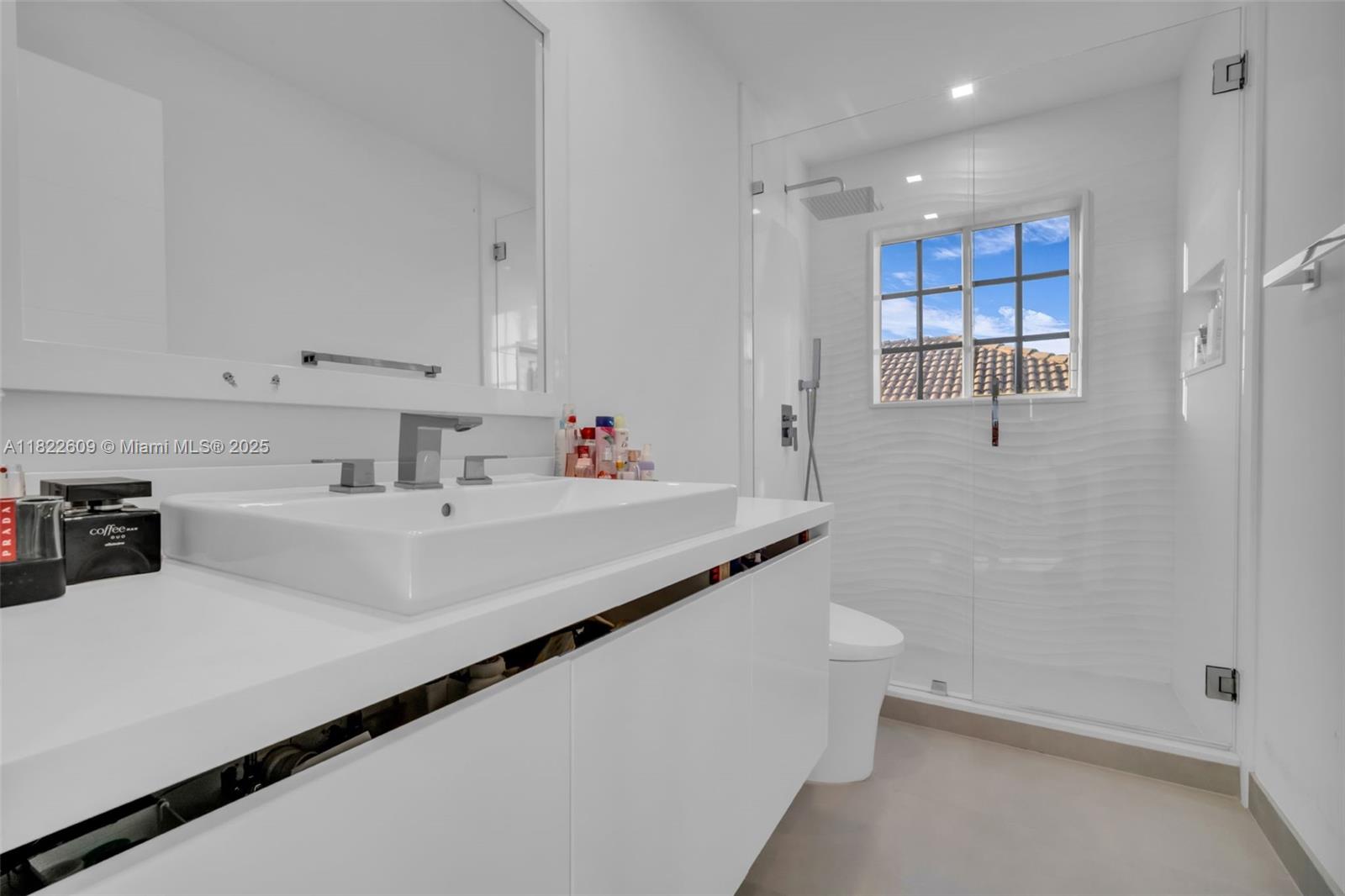 942 Lavender Circle Weston, FL 33327 - Photo 38 of 68 a bathroom with a sink a toilet and shower