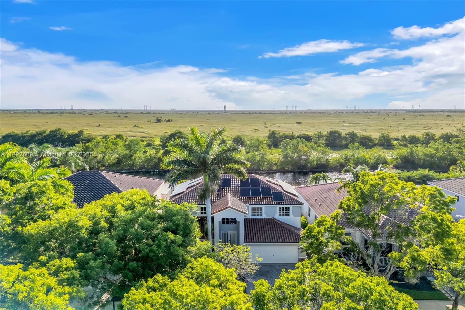 942 Lavender Circle Weston, FL 33327 - Photo 54 of 68 an aerial view of a house with a garden