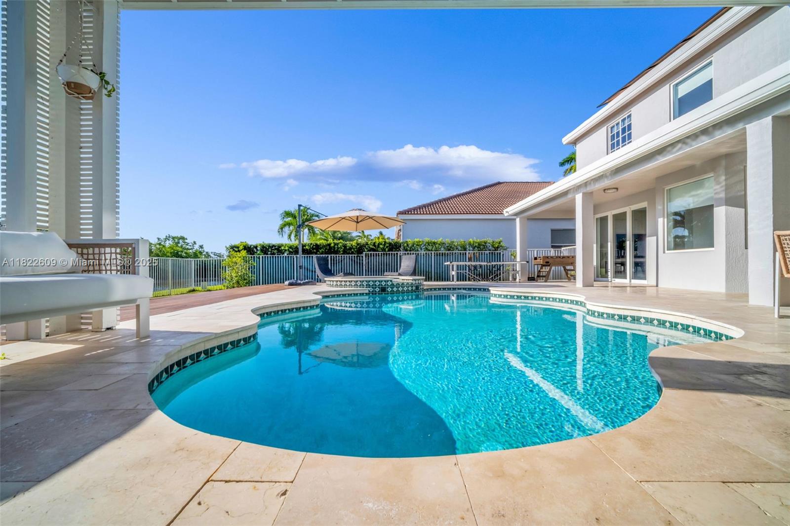 942 Lavender Circle Weston, FL 33327 - Photo 8 of 68 a view of a swimming pool with a patio
