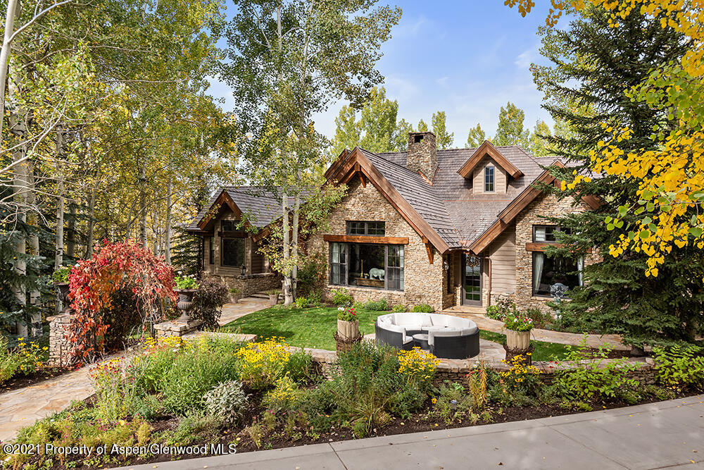 18 Cascade Lane Aspen, CO 81611 - Photo 1 of 32 a front view of a house with garden