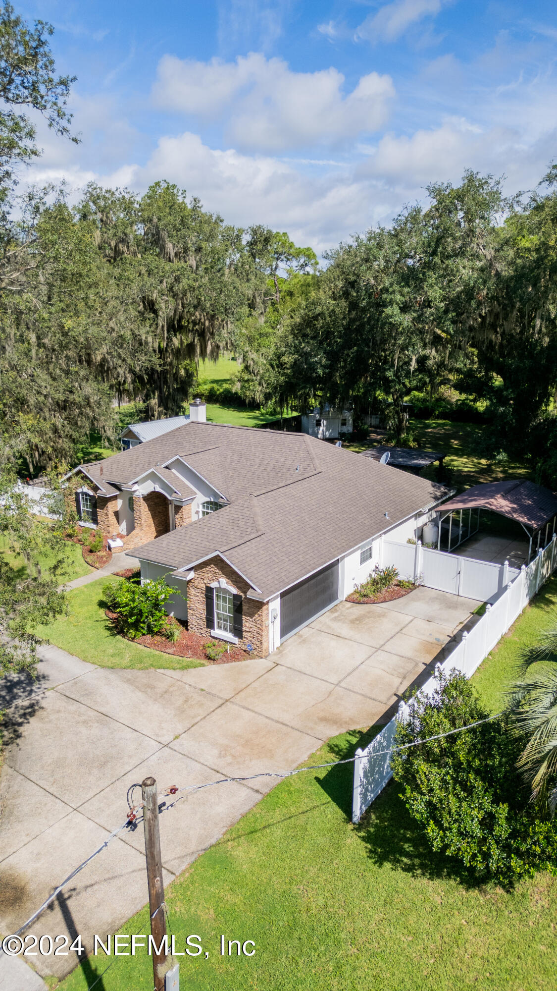 112 Eberhard Avenue Palatka, FL 32177 - Photo 14 of 48 an aerial view of residential houses with outdoor space and trees