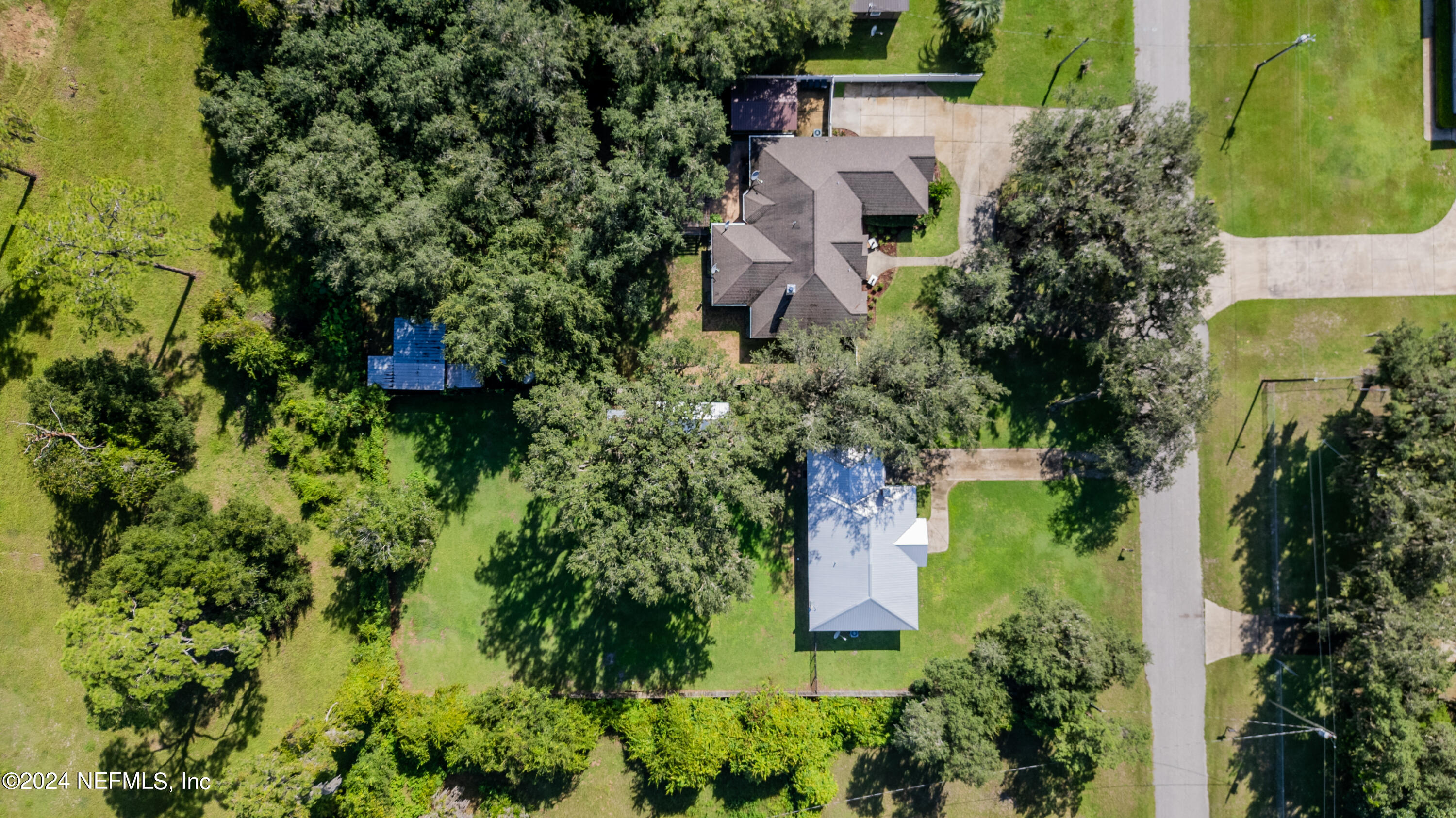 112 Eberhard Avenue Palatka, FL 32177 - Photo 19 of 48 an aerial view of a house with a yard and garden