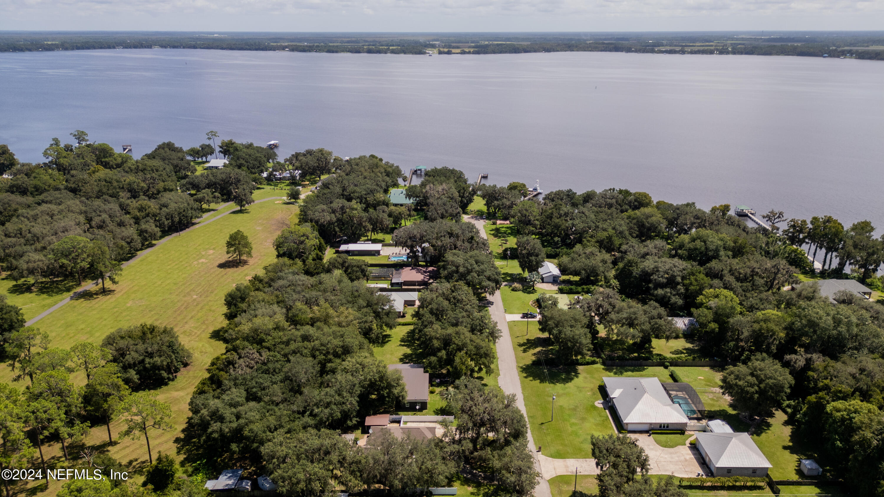 112 Eberhard Avenue Palatka, FL 32177 - Photo 24 of 48 an aerial view of a house with a yard and lake view