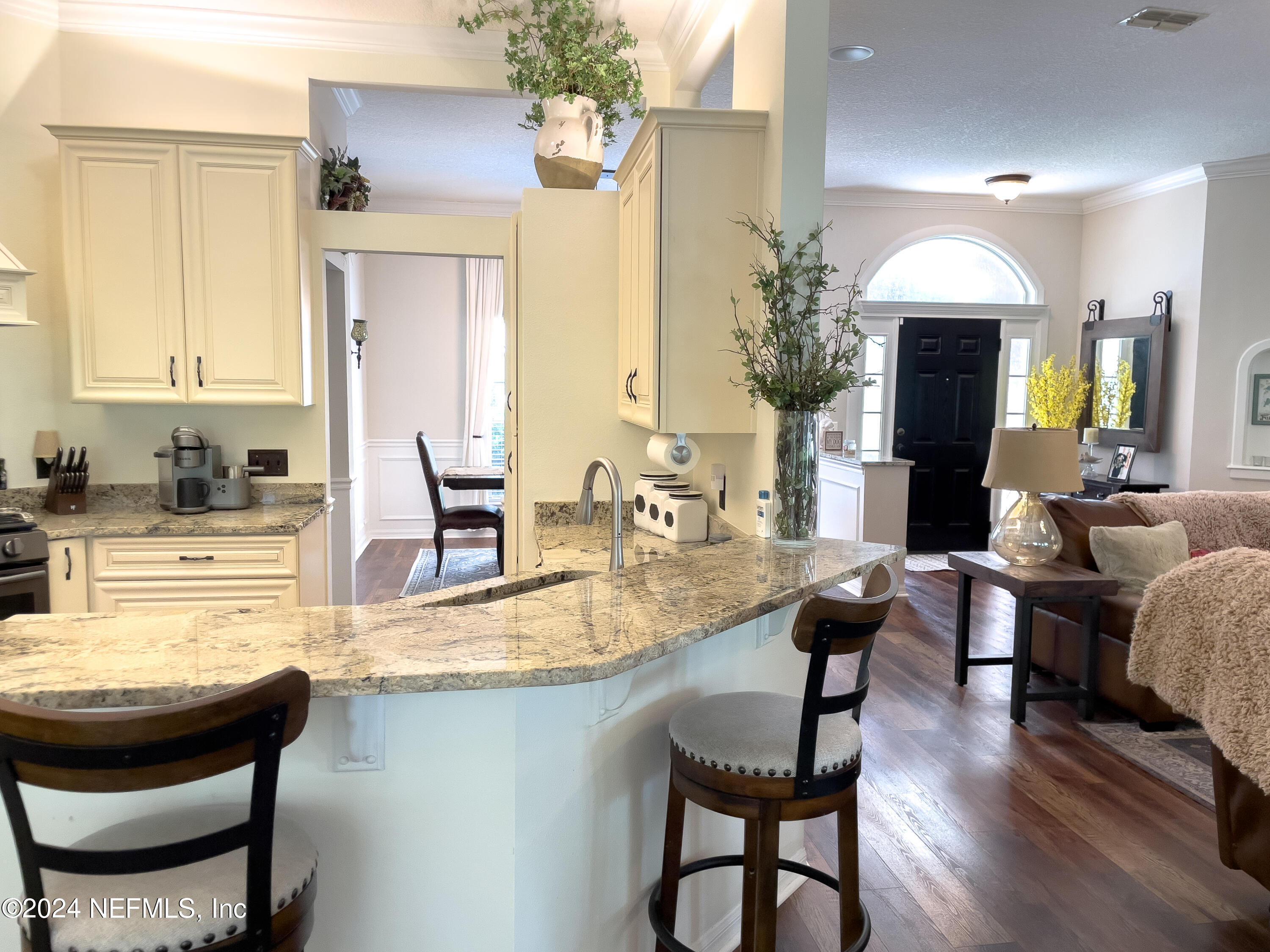 112 Eberhard Avenue Palatka, FL 32177 - Photo 26 of 48 a kitchen with a dining table chairs sink and cabinets
