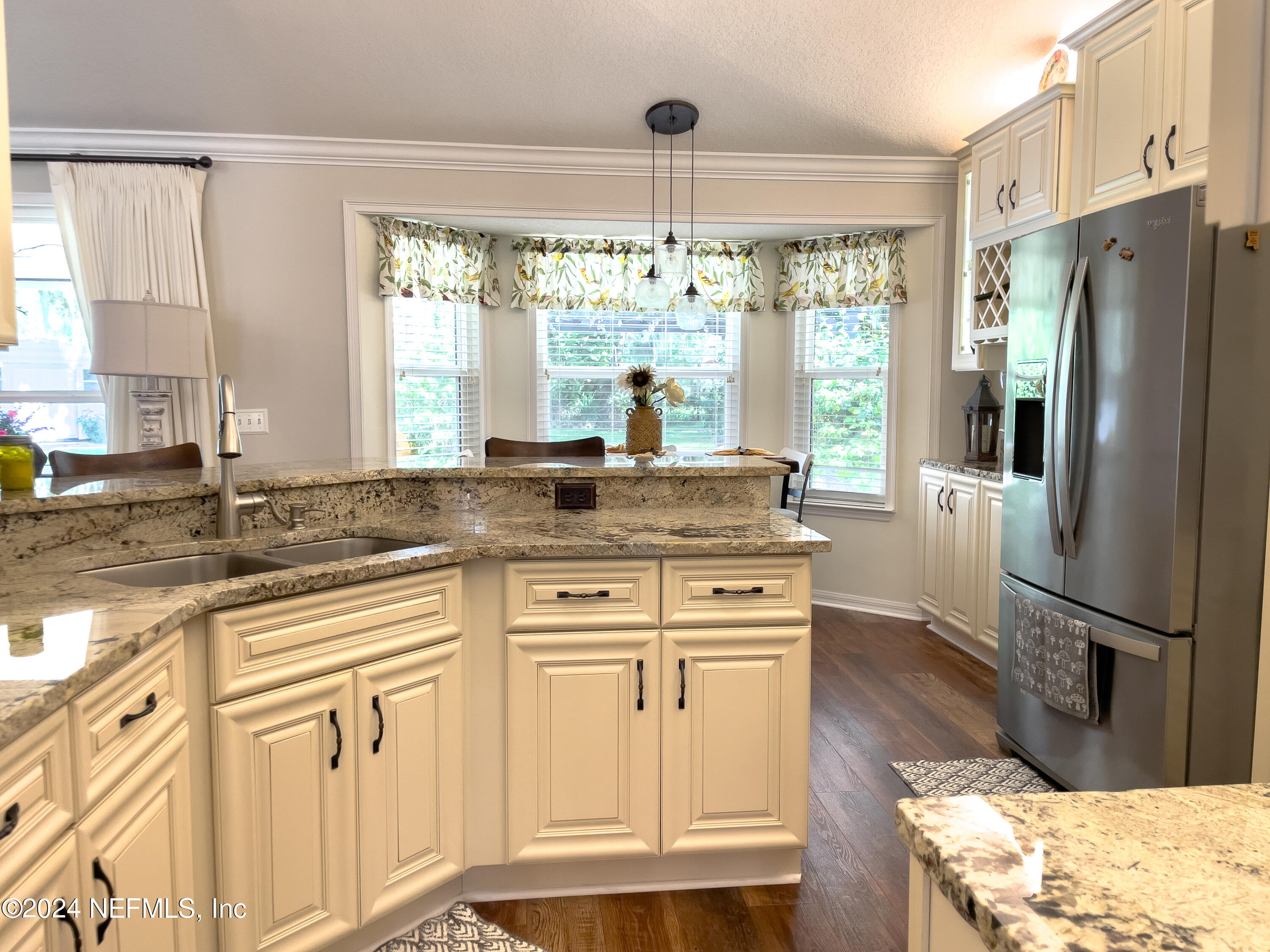 112 Eberhard Avenue Palatka, FL 32177 - Photo 29 of 48 a kitchen with stainless steel appliances granite countertop a refrigerator and a sink