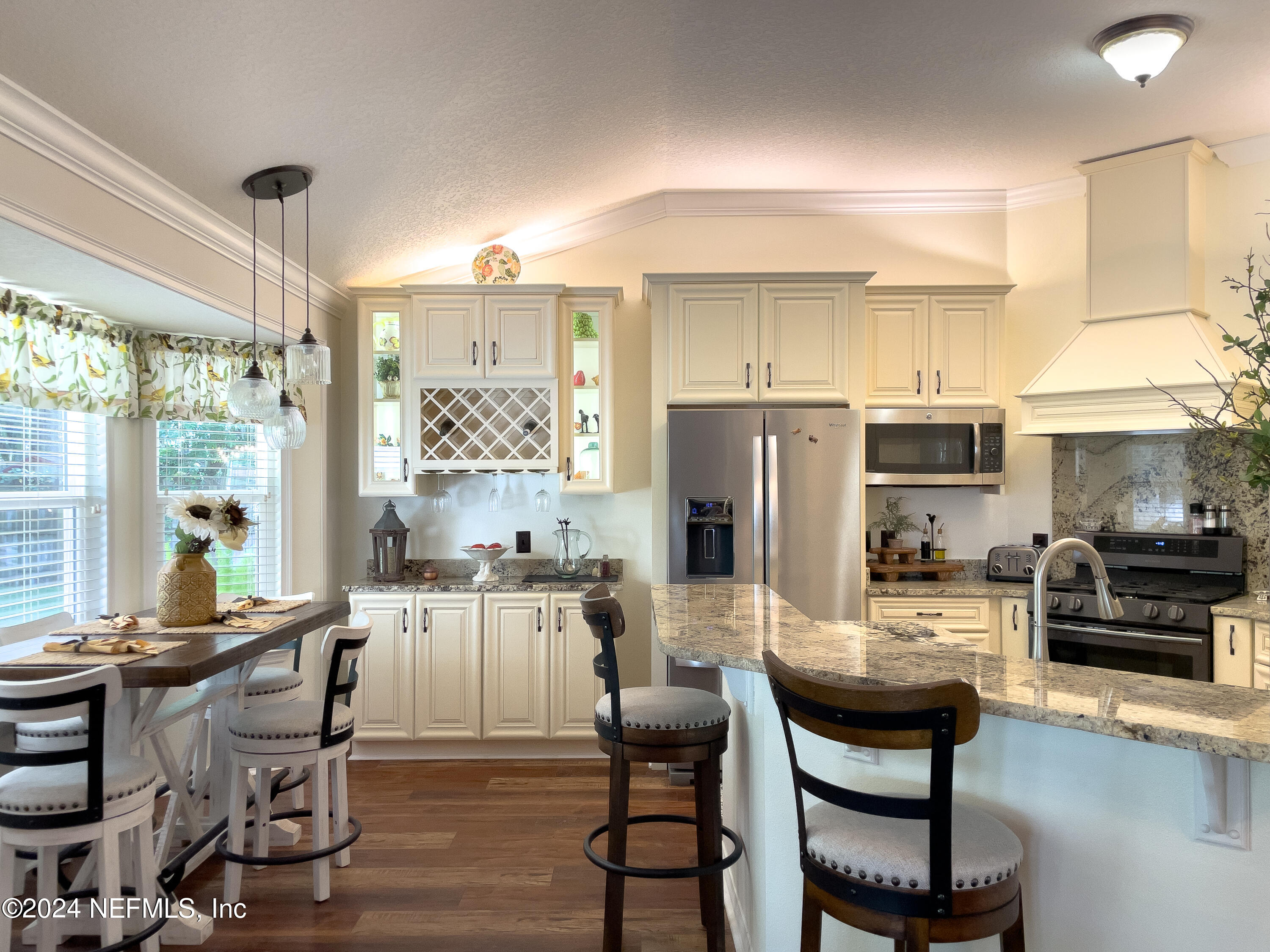 112 Eberhard Avenue Palatka, FL 32177 - Photo 31 of 48 a dining room with furniture a chandelier and wooden floor