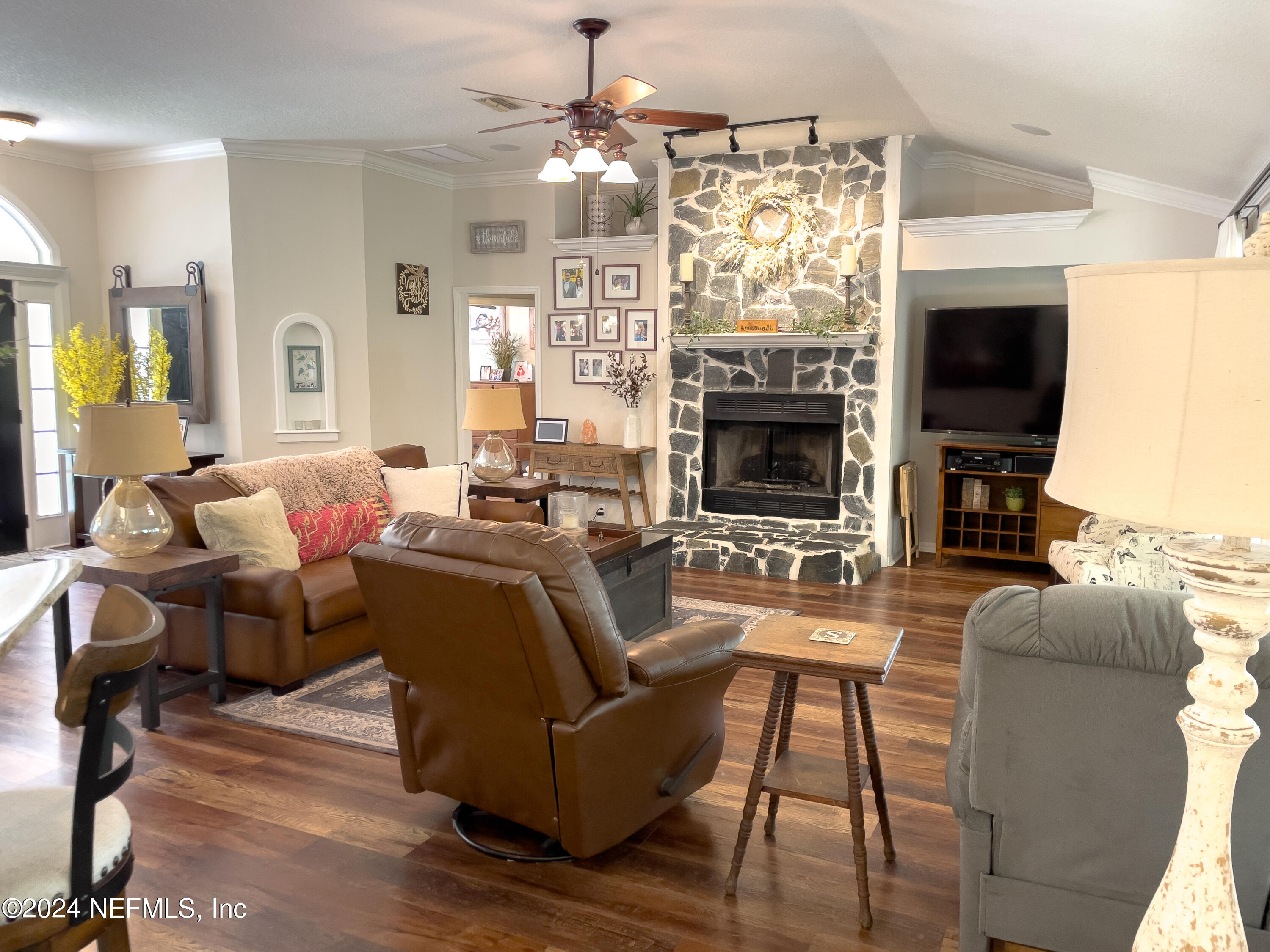 112 Eberhard Avenue Palatka, FL 32177 - Photo 33 of 48 a living room with fireplace furniture and a flat screen tv