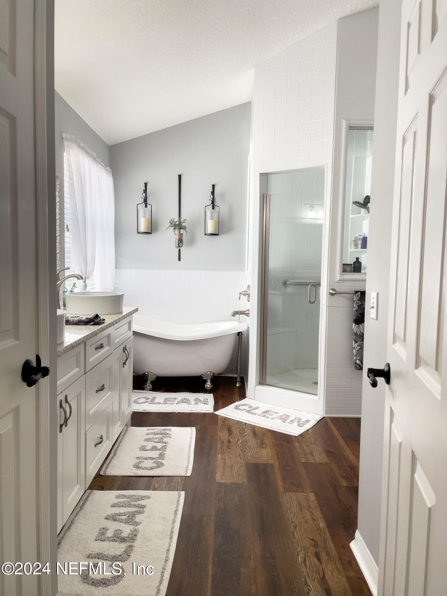 112 Eberhard Avenue Palatka, FL 32177 - Photo 39 of 48 a spacious bathroom with a double vanity sink and a mirror