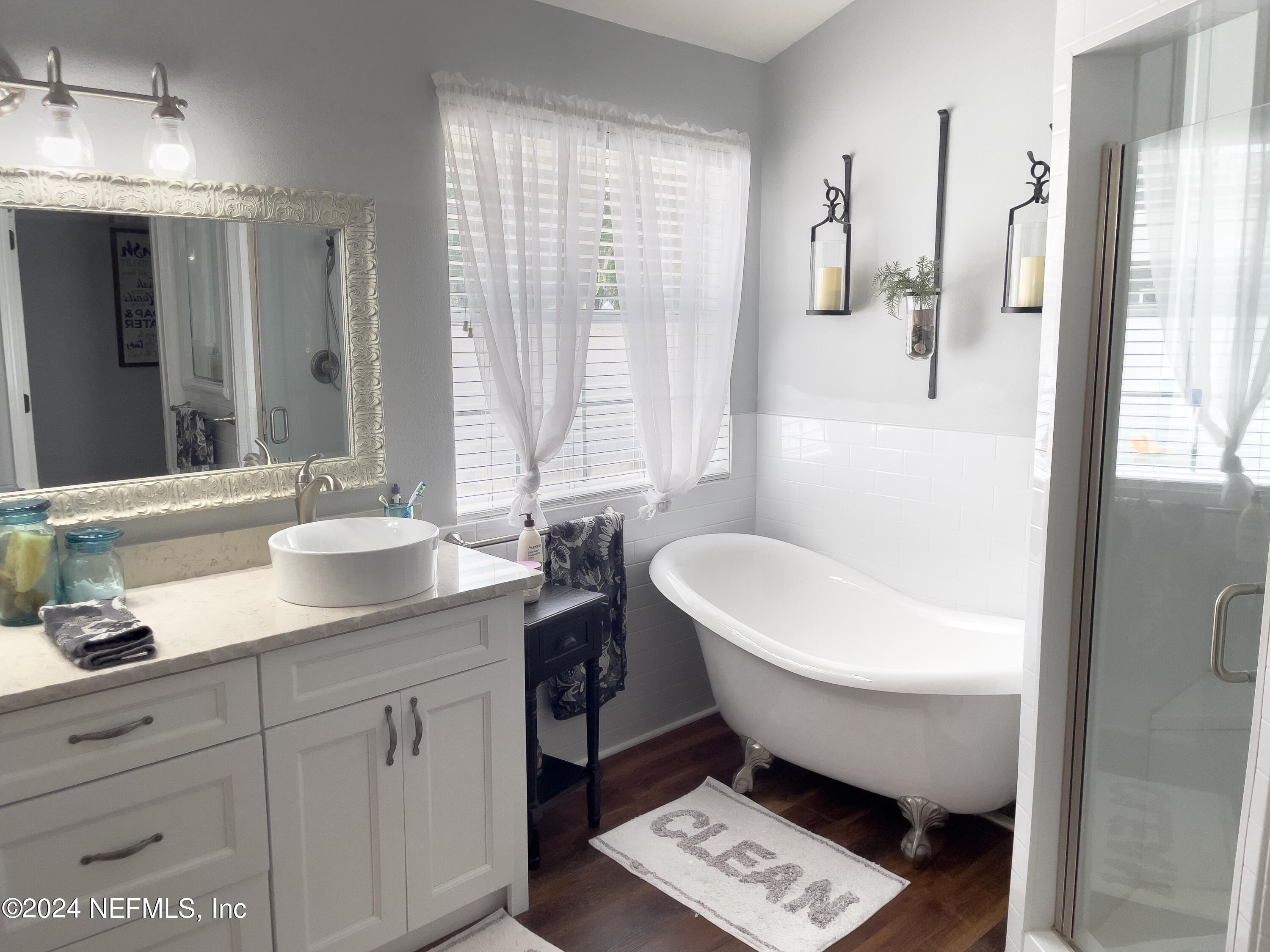 112 Eberhard Avenue Palatka, FL 32177 - Photo 40 of 48 a bathroom with a granite countertop sink toilet and shower