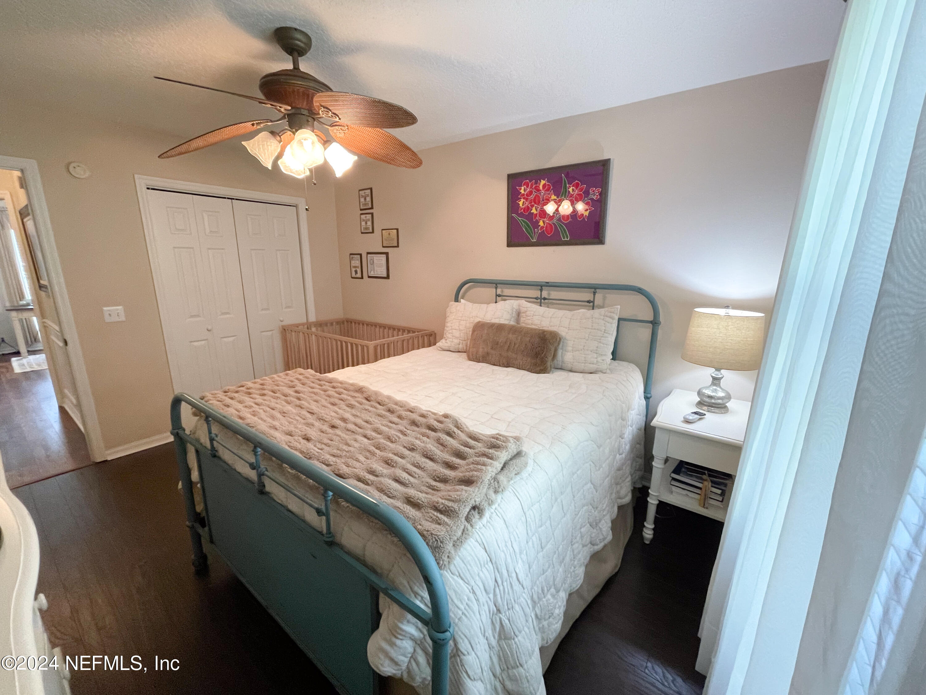 112 Eberhard Avenue Palatka, FL 32177 - Photo 44 of 48 a bedroom with a bed and a chandelier