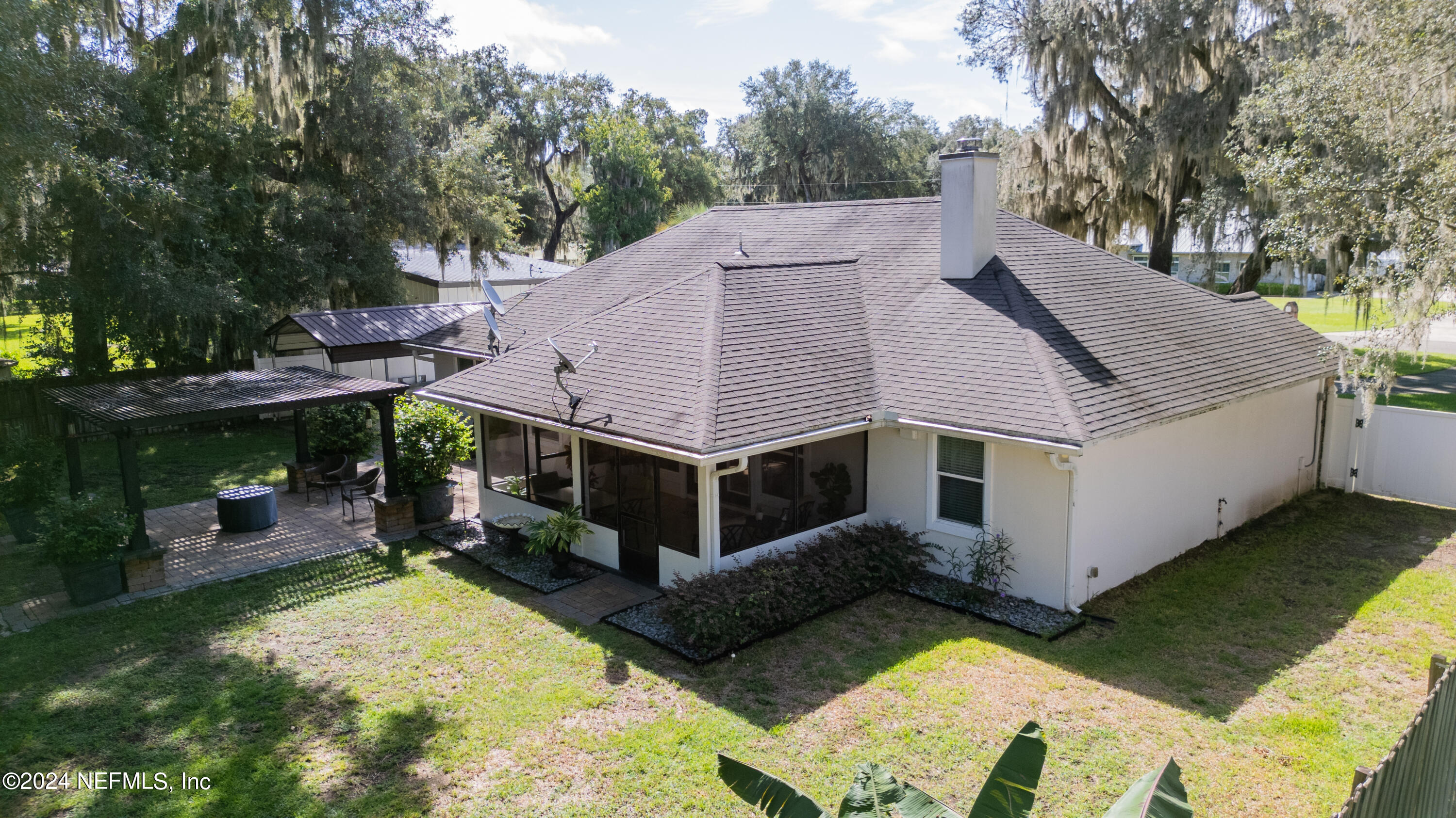 112 Eberhard Avenue Palatka, FL 32177 - Photo 10 of 48 a view of a house with a yard and large tree