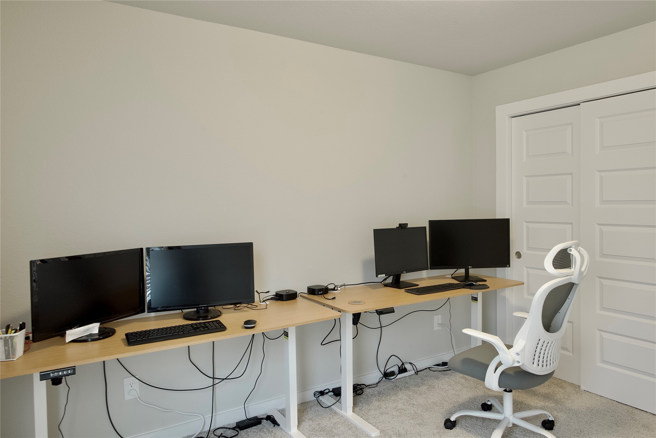 3207 Tilley Drive Rosenberg, TX 77471 - Photo 36 of 43 a view of a workspace with a computer on a desk chair and a a window