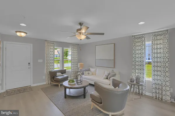 a living room with furniture and a window