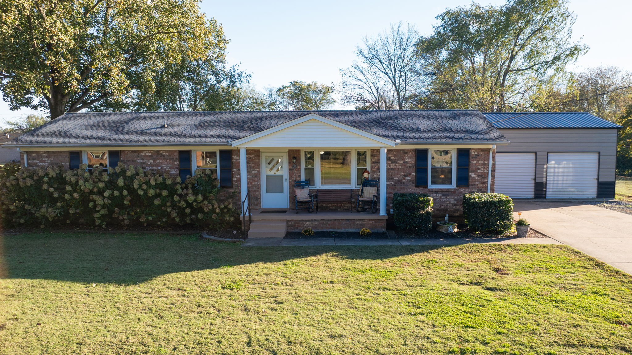 a front view of a house with a garden