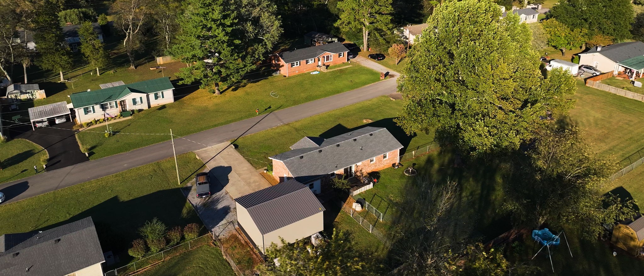 2245 North Ranch Road Murfreesboro, TN 37129 - Photo 28 of 29 an aerial view of a house with a yard and trees all around