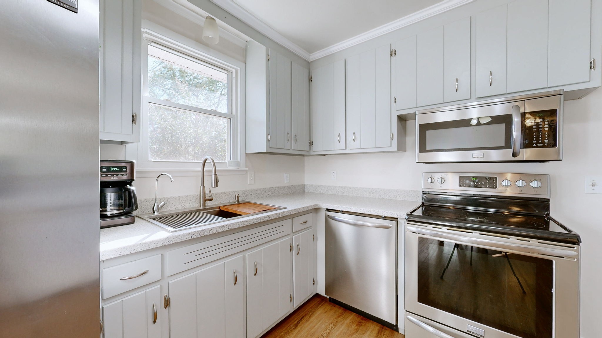 2245 North Ranch Road Murfreesboro, TN 37129 - Photo 9 of 29 a kitchen with cabinets appliances a sink and a window