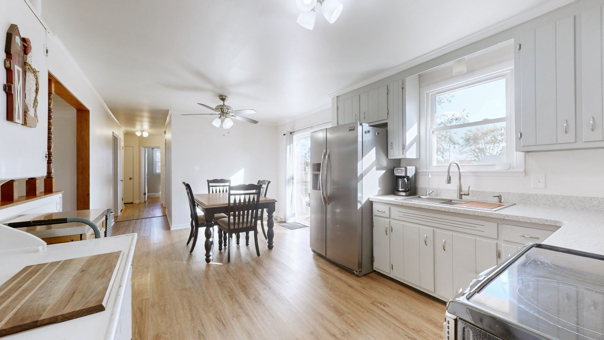 2245 North Ranch Road Murfreesboro, TN 37129 - Photo 10 of 29 a kitchen with refrigerator cabinets dining table and chairs