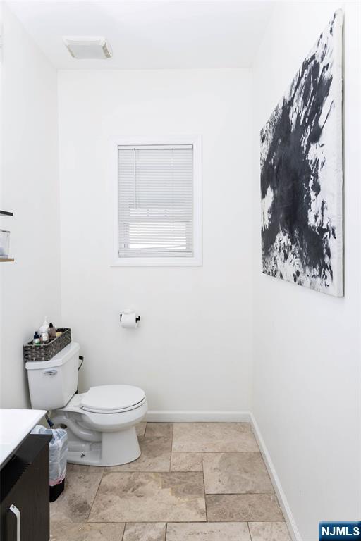 126 Ridge Avenue Bloomfield, NJ 07003 - Photo 17 of 45 a white toilet sitting next to a white walls