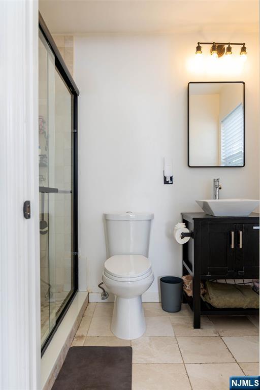 126 Ridge Avenue Bloomfield, NJ 07003 - Photo 23 of 45 a bathroom with a toilet sink and mirror