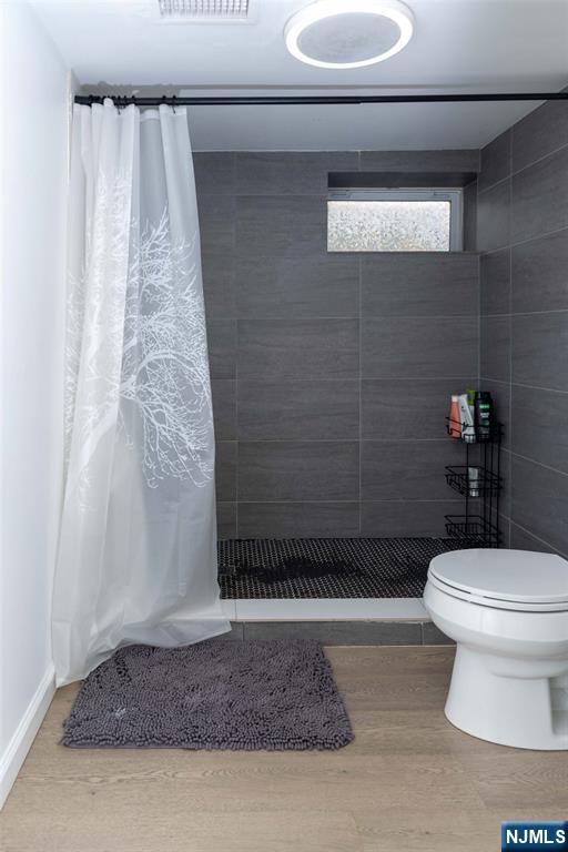 126 Ridge Avenue Bloomfield, NJ 07003 - Photo 38 of 45 a bathroom with a toilet and a shower