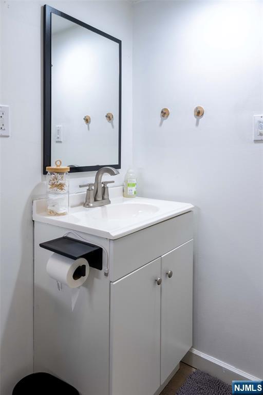126 Ridge Avenue Bloomfield, NJ 07003 - Photo 39 of 45 a bathroom with a sink and a mirror