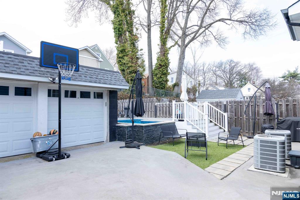 126 Ridge Avenue Bloomfield, NJ 07003 - Photo 40 of 45 a view of a house with backyard and a tree